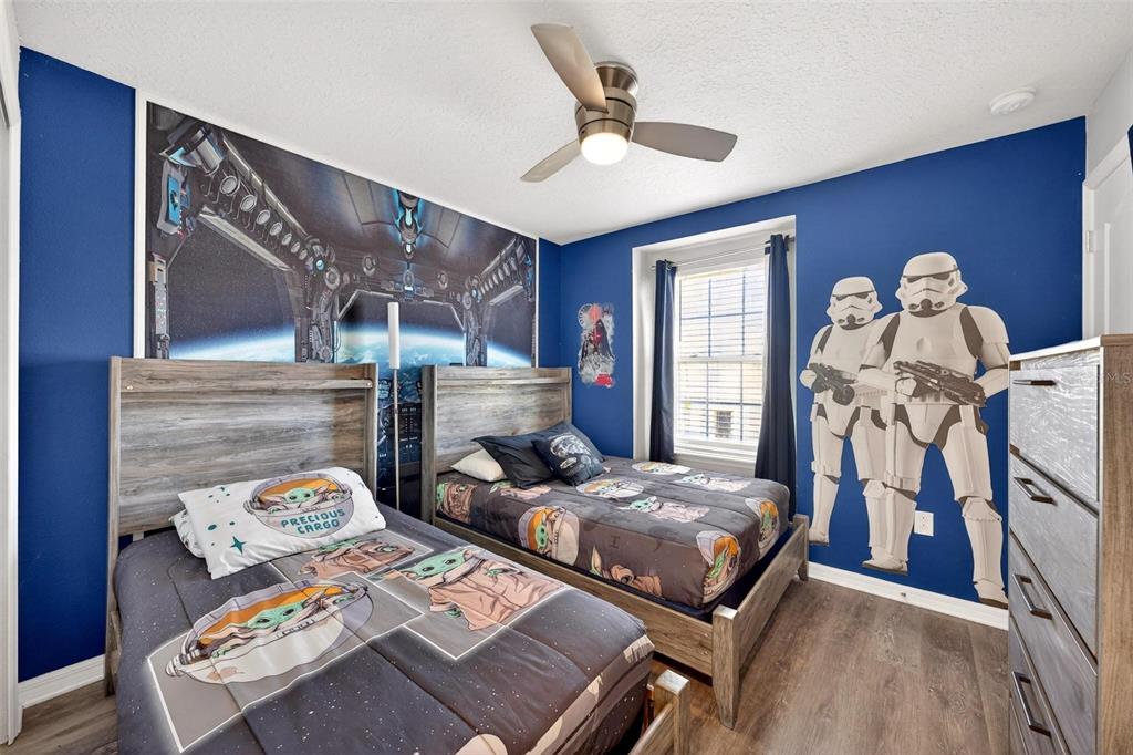 7554 Oak Spring Lane Davenport, FL 33837 - Photo 47 of 74 a bedroom with two beds and a window