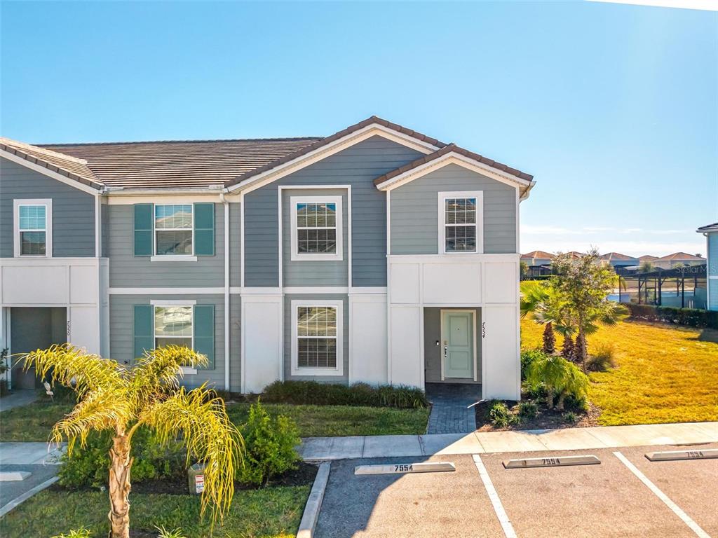 7554 Oak Spring Lane Davenport, FL 33837 - Photo 53 of 74 a front view of a house with a yard