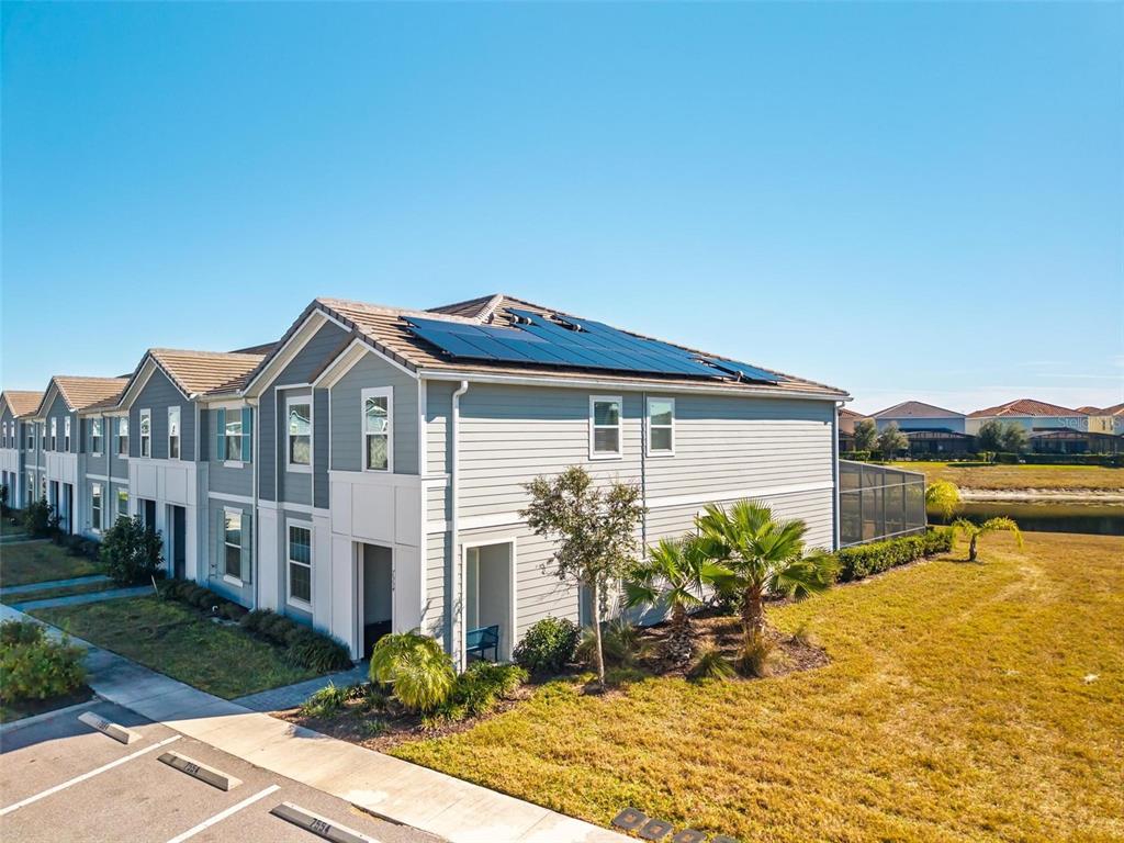 7554 Oak Spring Lane Davenport, FL 33837 - Photo 58 of 74 a front view of a house with a yard