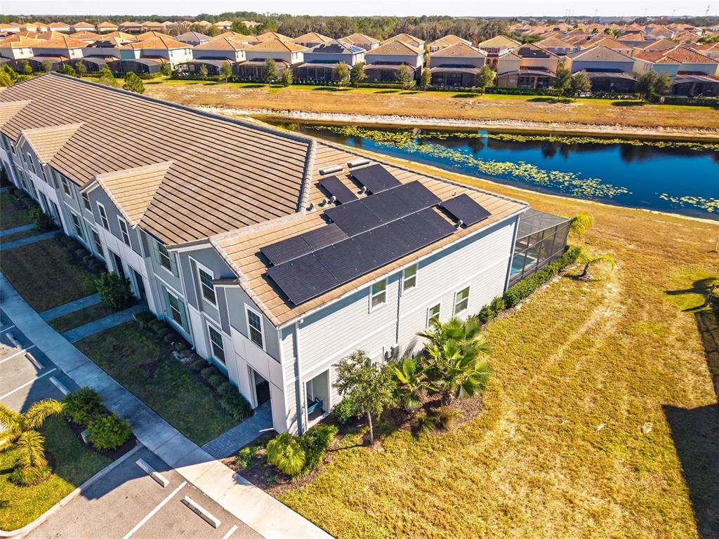 7554 Oak Spring Lane Davenport, FL 33837 - Photo 60 of 74 a view of a swimming pool with outdoor seating and plants