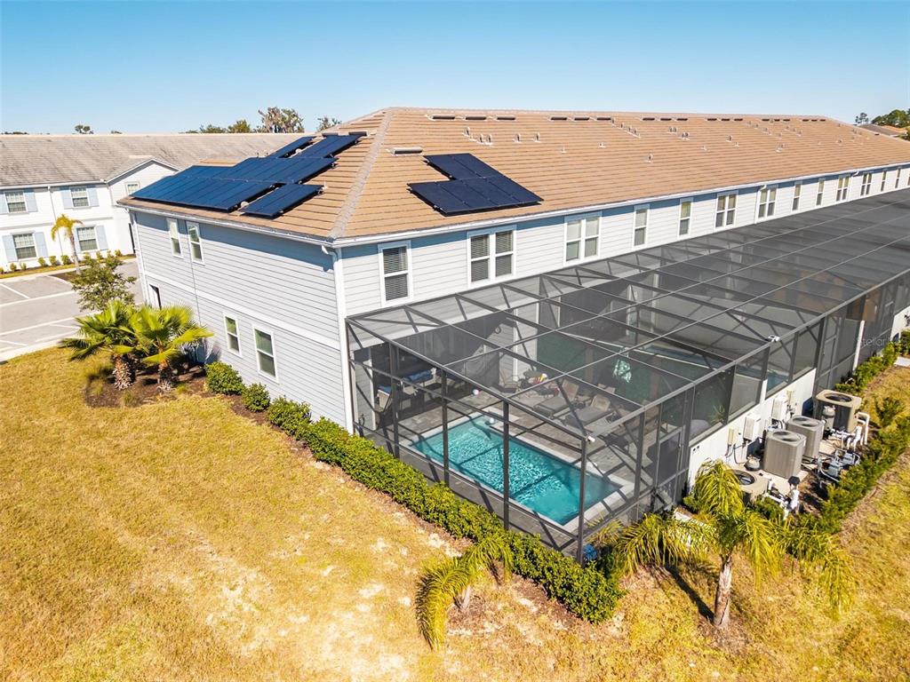 7554 Oak Spring Lane Davenport, FL 33837 - Photo 65 of 74 a aerial view of a house with swimming pool