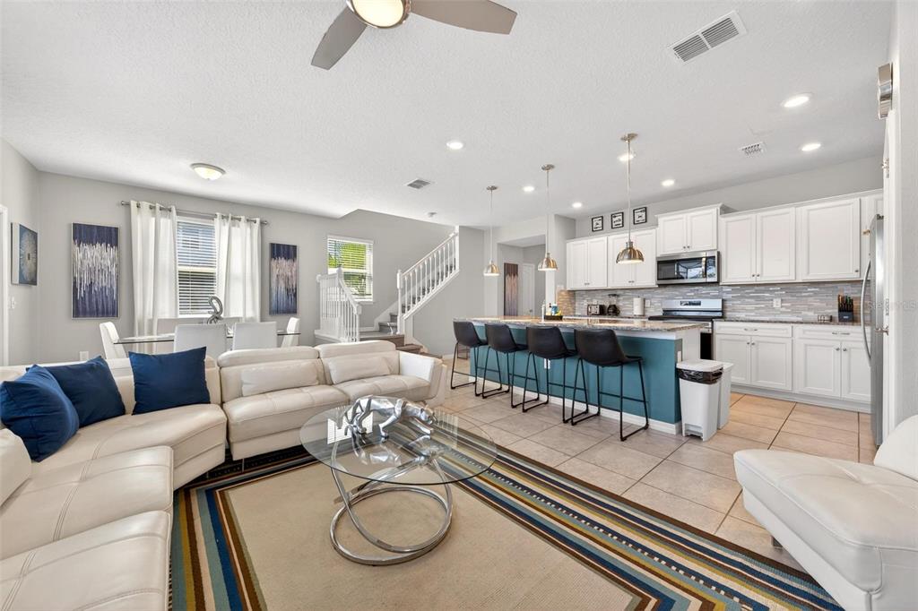 7554 Oak Spring Lane Davenport, FL 33837 - Photo 8 of 74 a living room with furniture kitchen and a table
