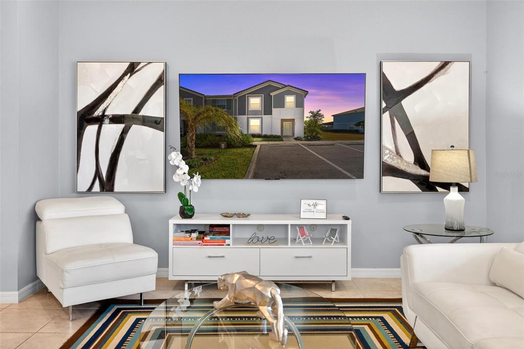 7554 Oak Spring Lane Davenport, FL 33837 - Photo 10 of 74 a living room with furniture and a flat screen tv