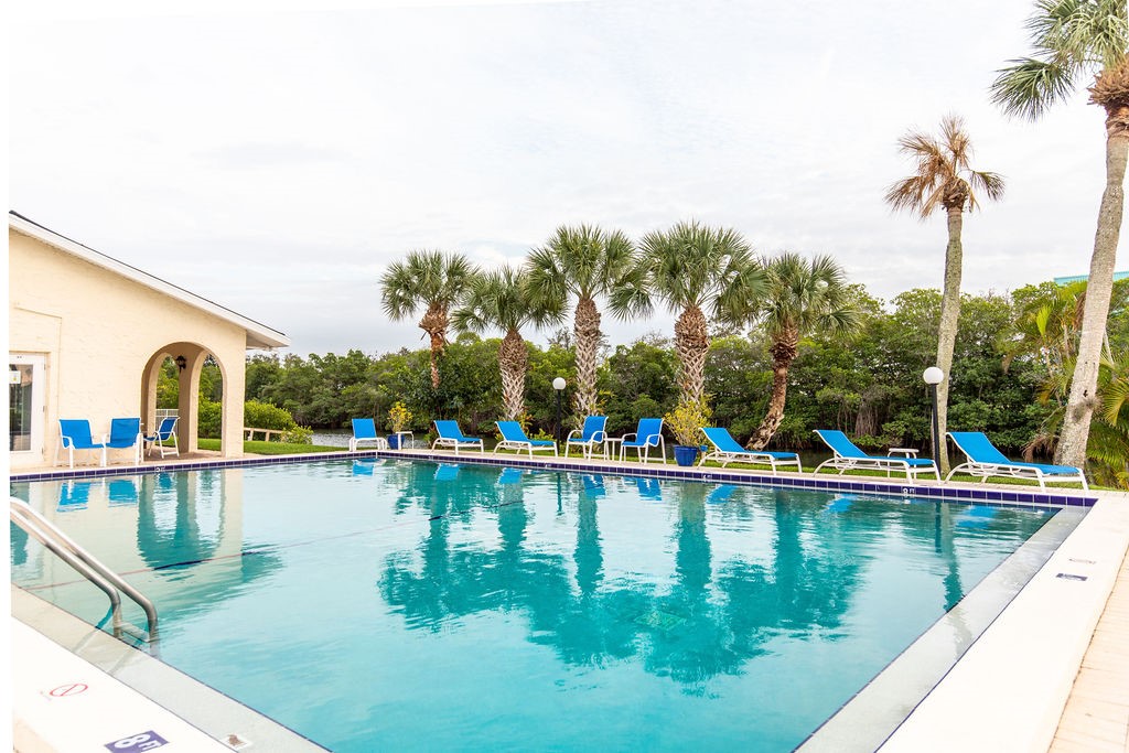 1815 Robalo Drive, Unit C201 Vero Beach, FL 32960 - Photo 1 of 31 a view of a lake with a house