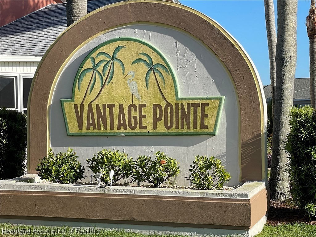 4366 Vantage Circle Sebring, FL 33872 - Photo 2 of 6 a sign that is on the side of a building
