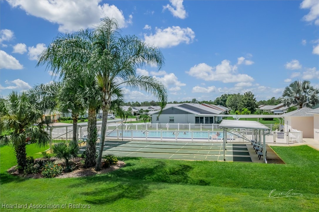 4366 Vantage Circle Sebring, FL 33872 - Photo 5 of 6 a front view of a house with a garden