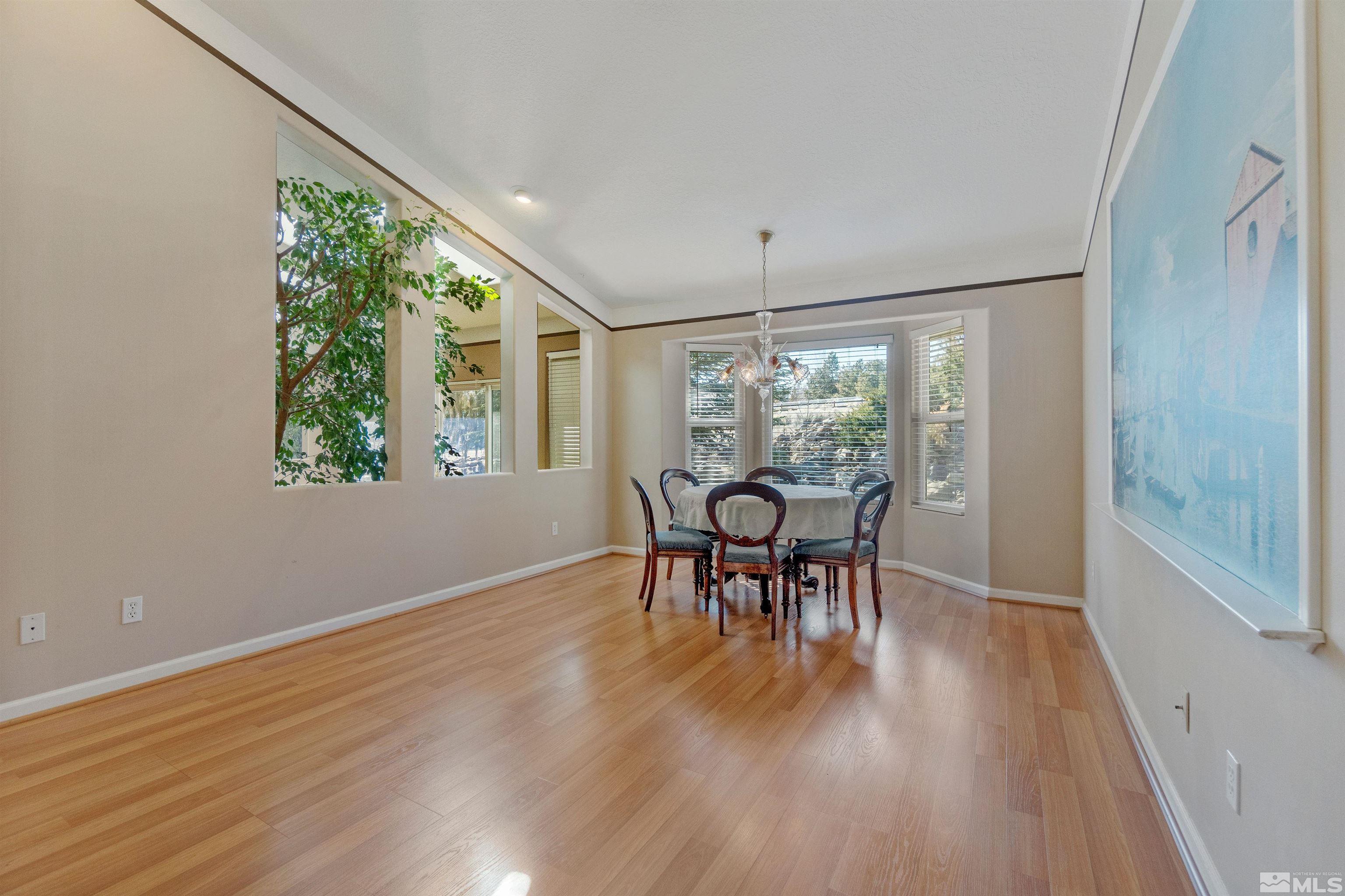 1200 Lampe Road Reno, NV 89511 - Photo 21 of 34 a view of a dining room with furniture window and wooden floor