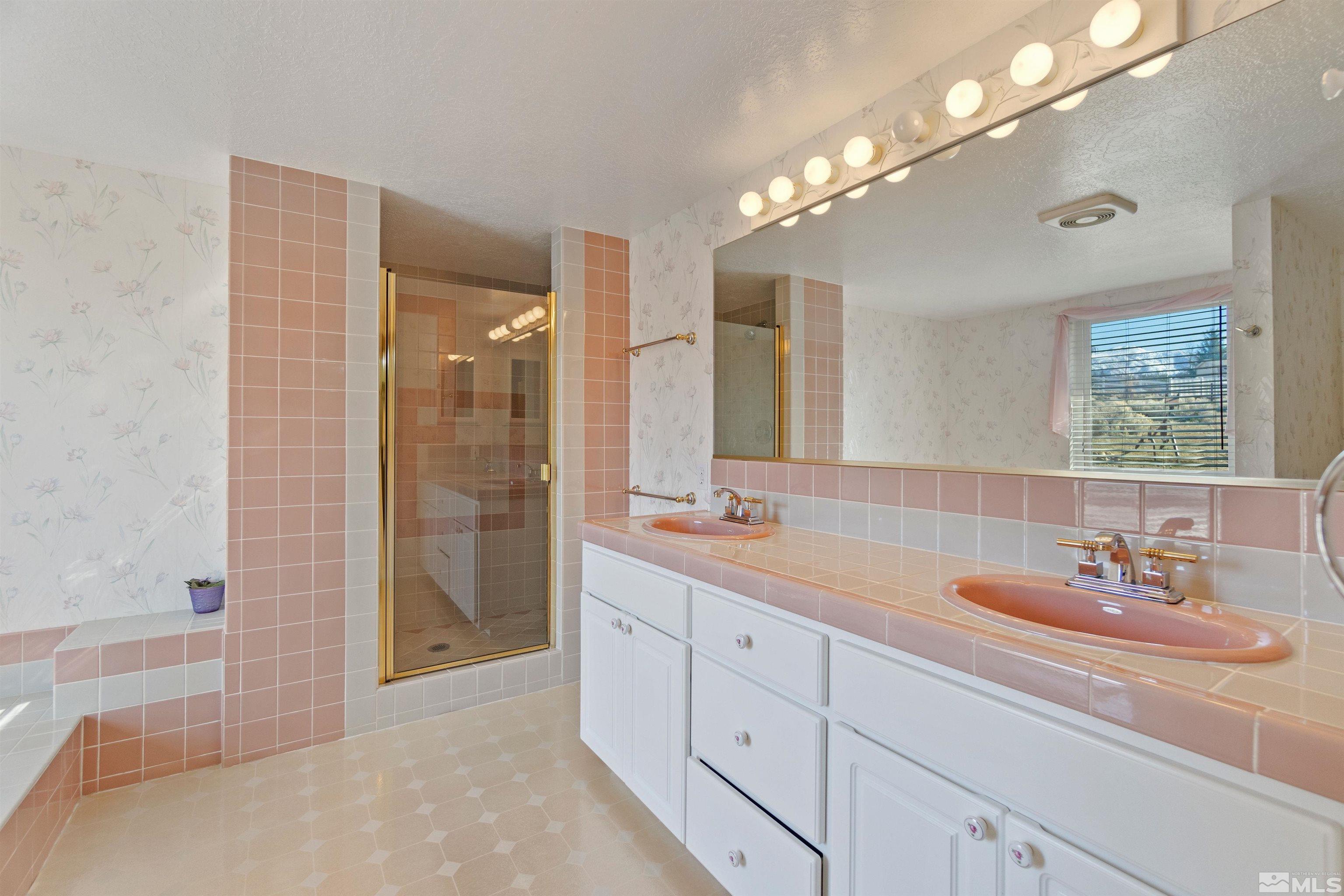 1200 Lampe Road Reno, NV 89511 - Photo 25 of 34 a bathroom with double vanity sinks and a shower