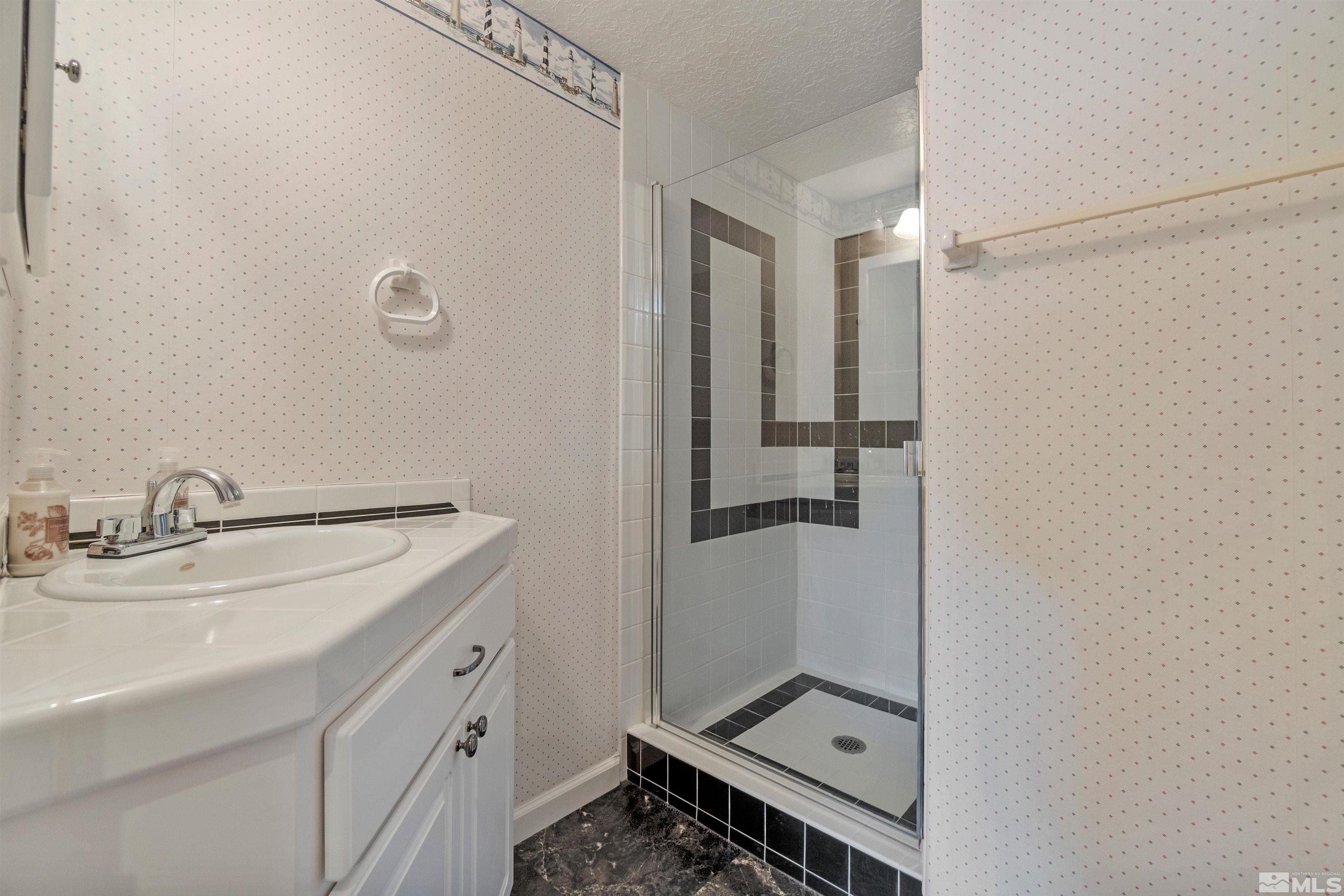 1200 Lampe Road Reno, NV 89511 - Photo 28 of 34 a bathroom with a sink and mirror