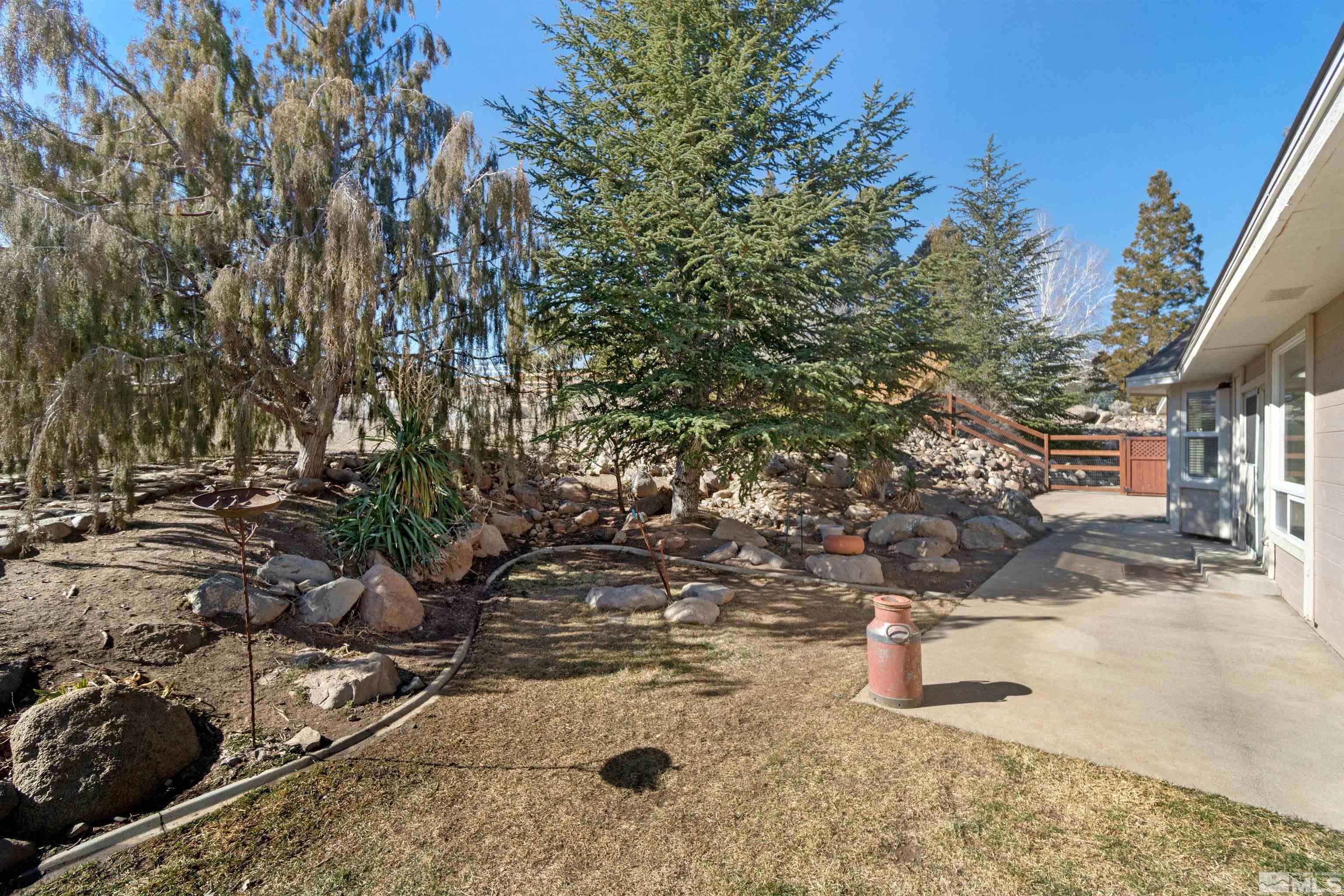 1200 Lampe Road Reno, NV 89511 - Photo 32 of 34 a view of a yard with wooden fence