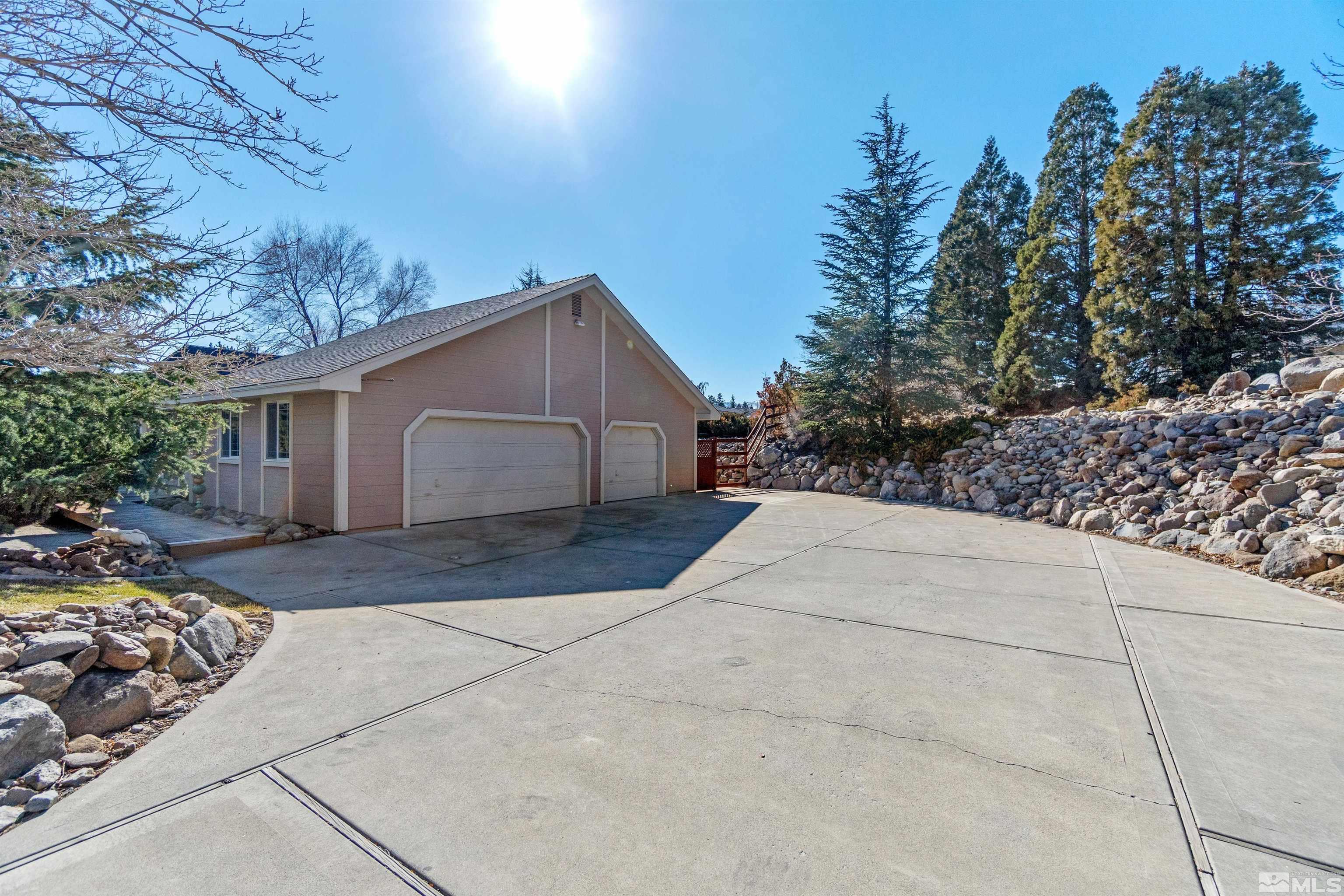 1200 Lampe Road Reno, NV 89511 - Photo 4 of 34 a view of backyard of house and trees