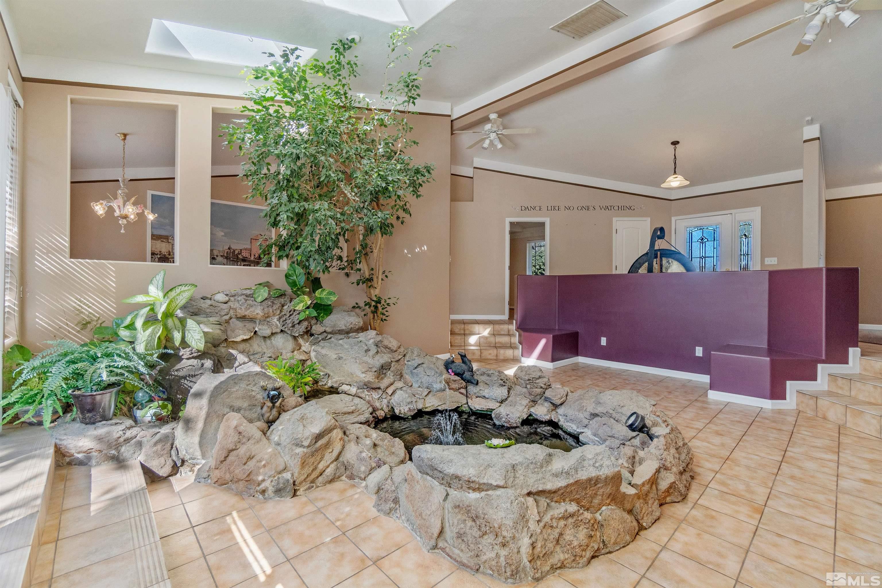 1200 Lampe Road Reno, NV 89511 - Photo 6 of 34 a living room with furniture and a potted plant