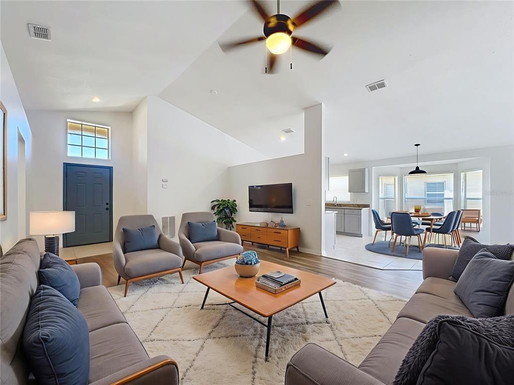 137 Piano Lane Davenport, FL 33896 - Photo 3 of 13 a living room with furniture and a flat screen tv