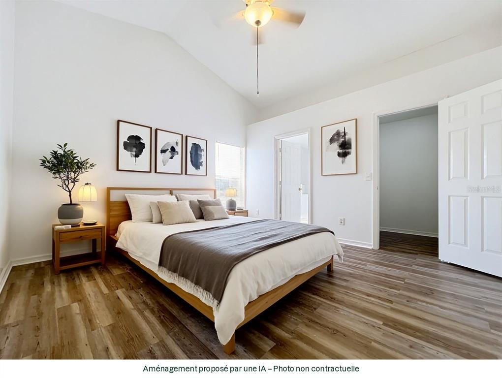 137 Piano Lane Davenport, FL 33896 - Photo 8 of 13 a bedroom with a bed and a potted plant