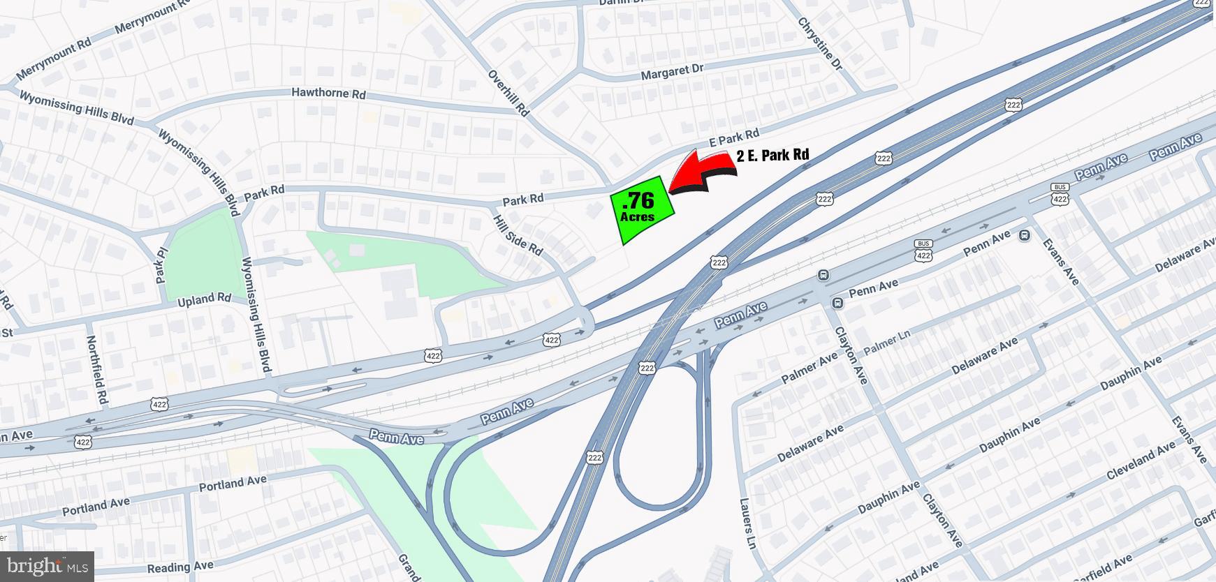 2 East Park Road Wyomissing, PA 19609 - Photo 2 of 6 a flower pot with a flower garden and a wooden bench