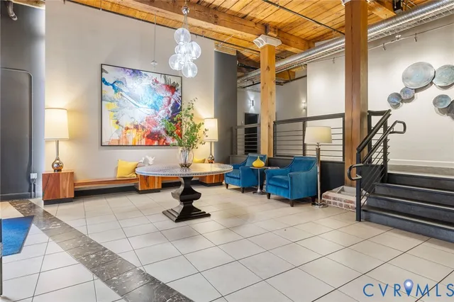 a room with gym equipment and a rug