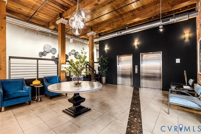 a living room with furniture and a table