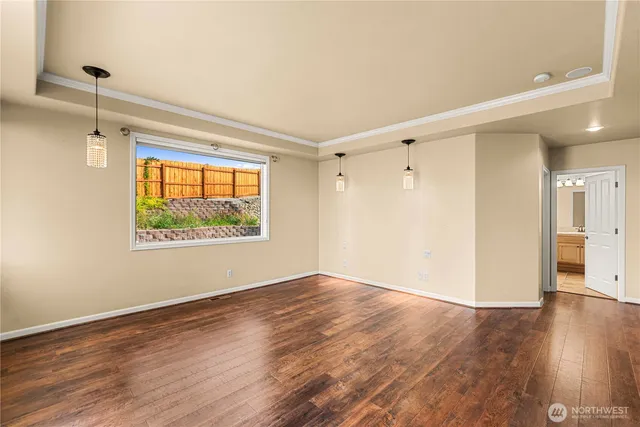 a spacious bathroom with a double vanity sink a mirror and a shower