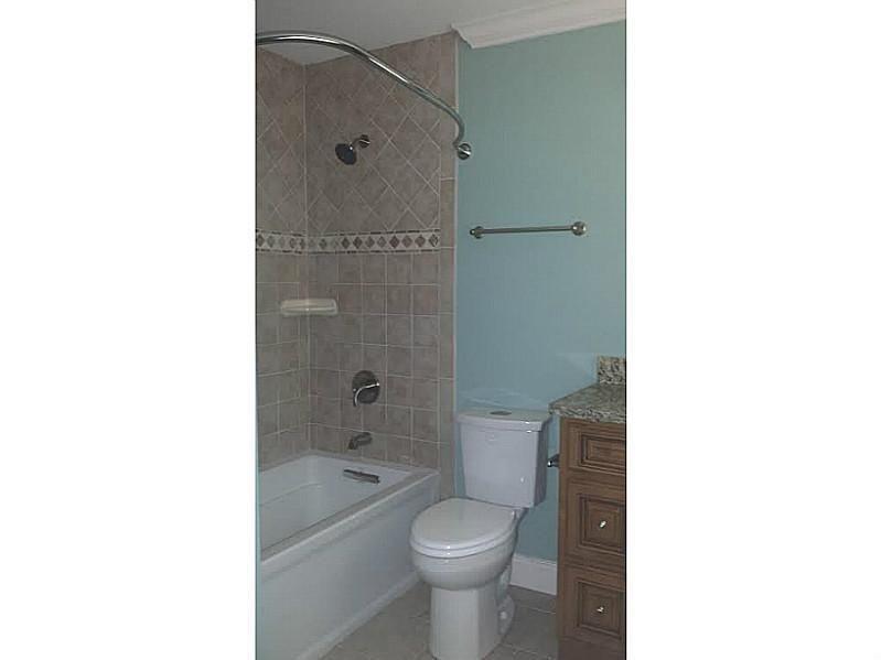 2076 Panola Road Lithonia, GA 30058 - Photo 4 of 16 a bathroom with a toilet a sink and shower