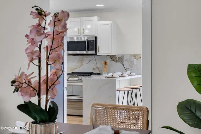 a view of a livingroom with furniture and chandelier