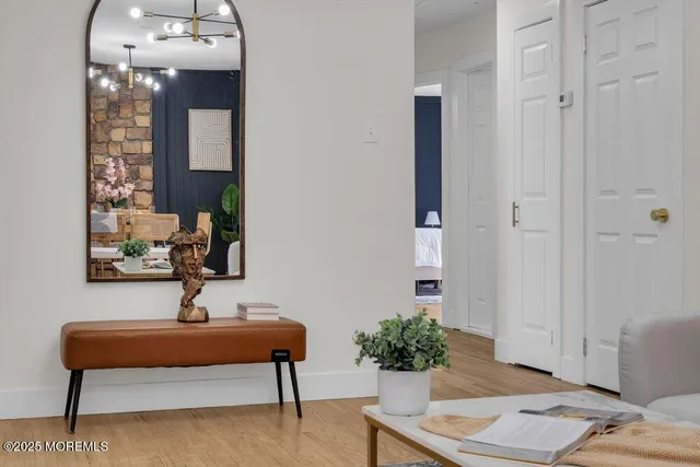 a kitchen with stainless steel appliances kitchen island granite countertop a stove a sink and a white cabinets