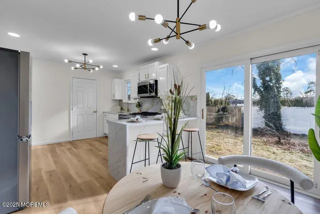 a kitchen with stainless steel appliances refrigerator and cabinets