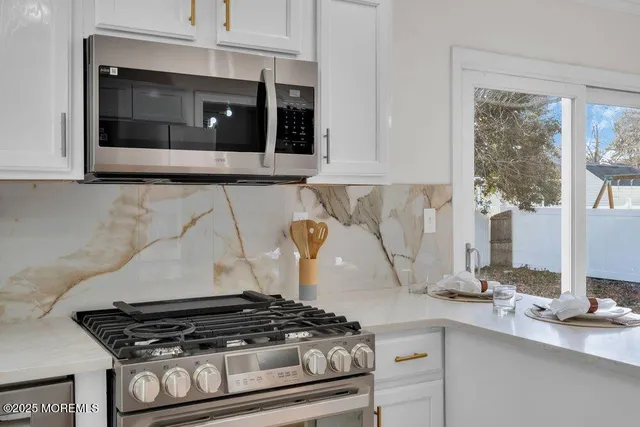 a view of a walk in closet and hallway