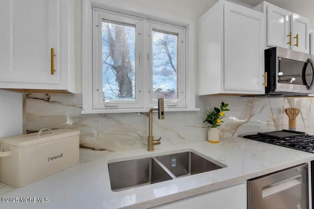 a bathroom with a bathtub a toilet and a shower