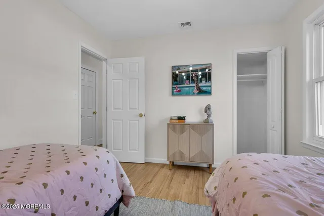 a view of a backyard with wooden fence