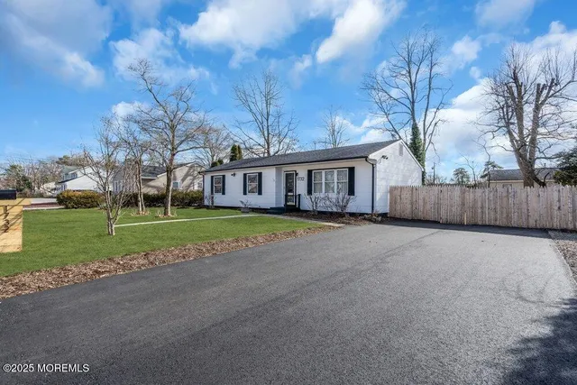 a view of house with outdoor space and lake view