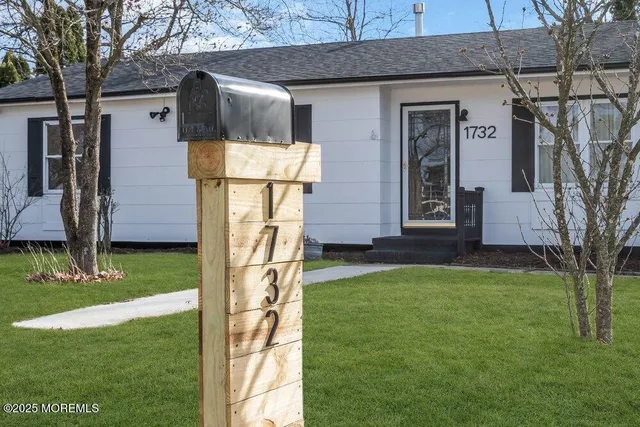 a room with a table and a potted plant