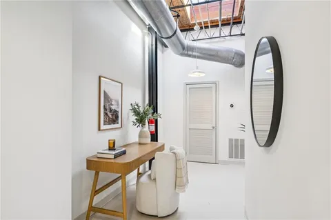 a bathroom with a sink a mirror and a shower