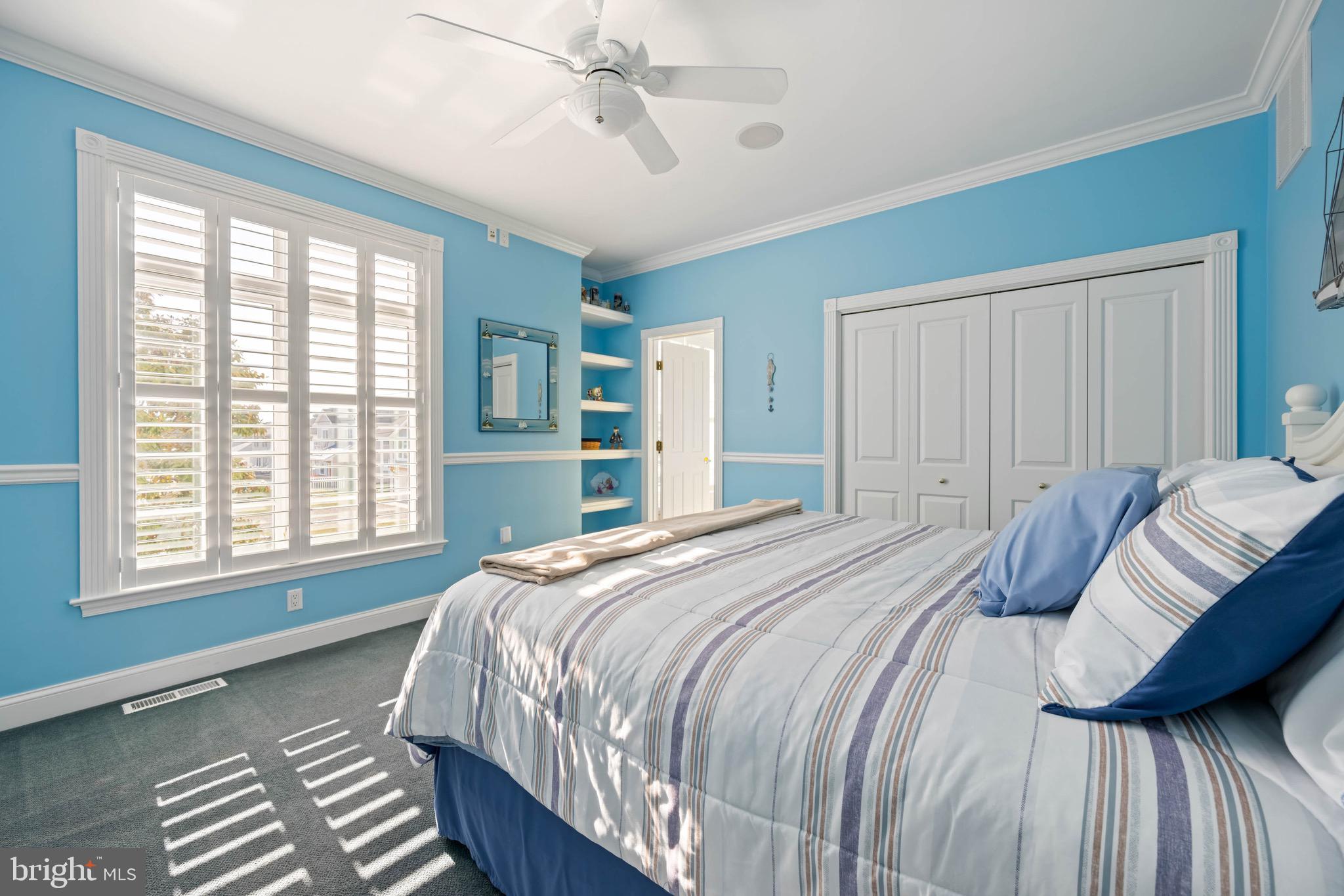 12959 Harbor Road Ocean City, MD 21842 - Photo 36 of 85 a bedroom with a bed and a window