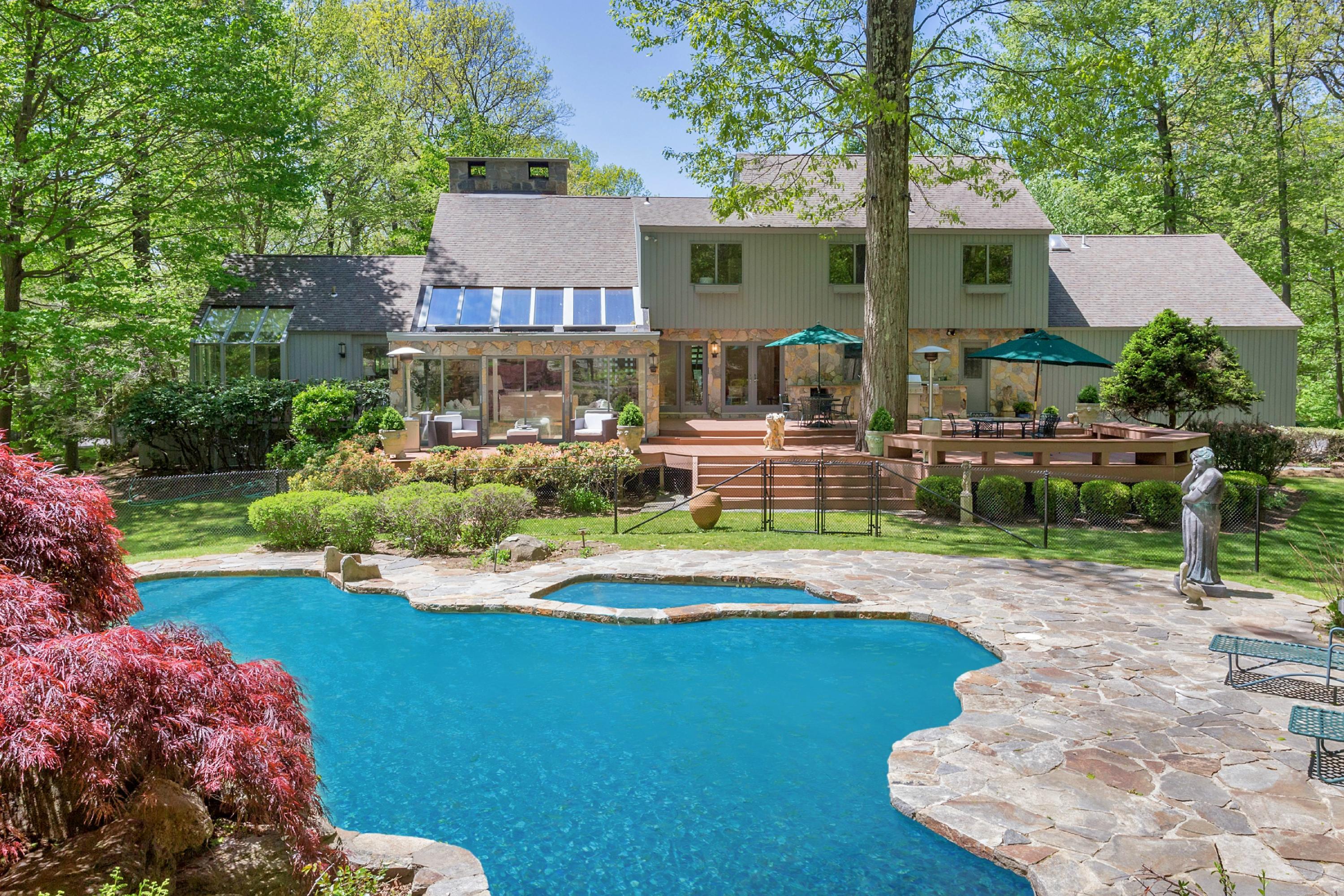a view of a house with a swimming pool