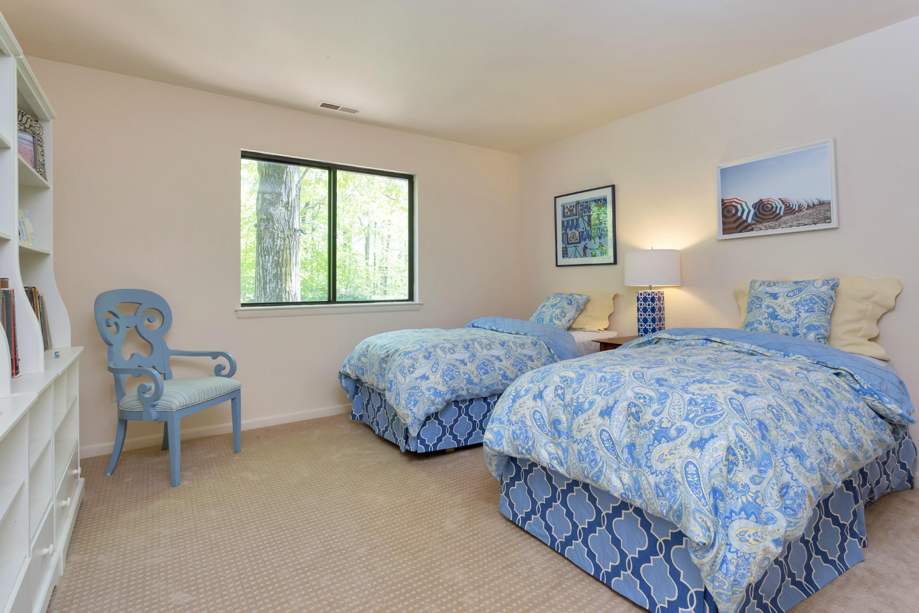 67 Sumner Road Greenwich, CT 06831 - Photo 15 of 25 a bedroom with two beds and a window