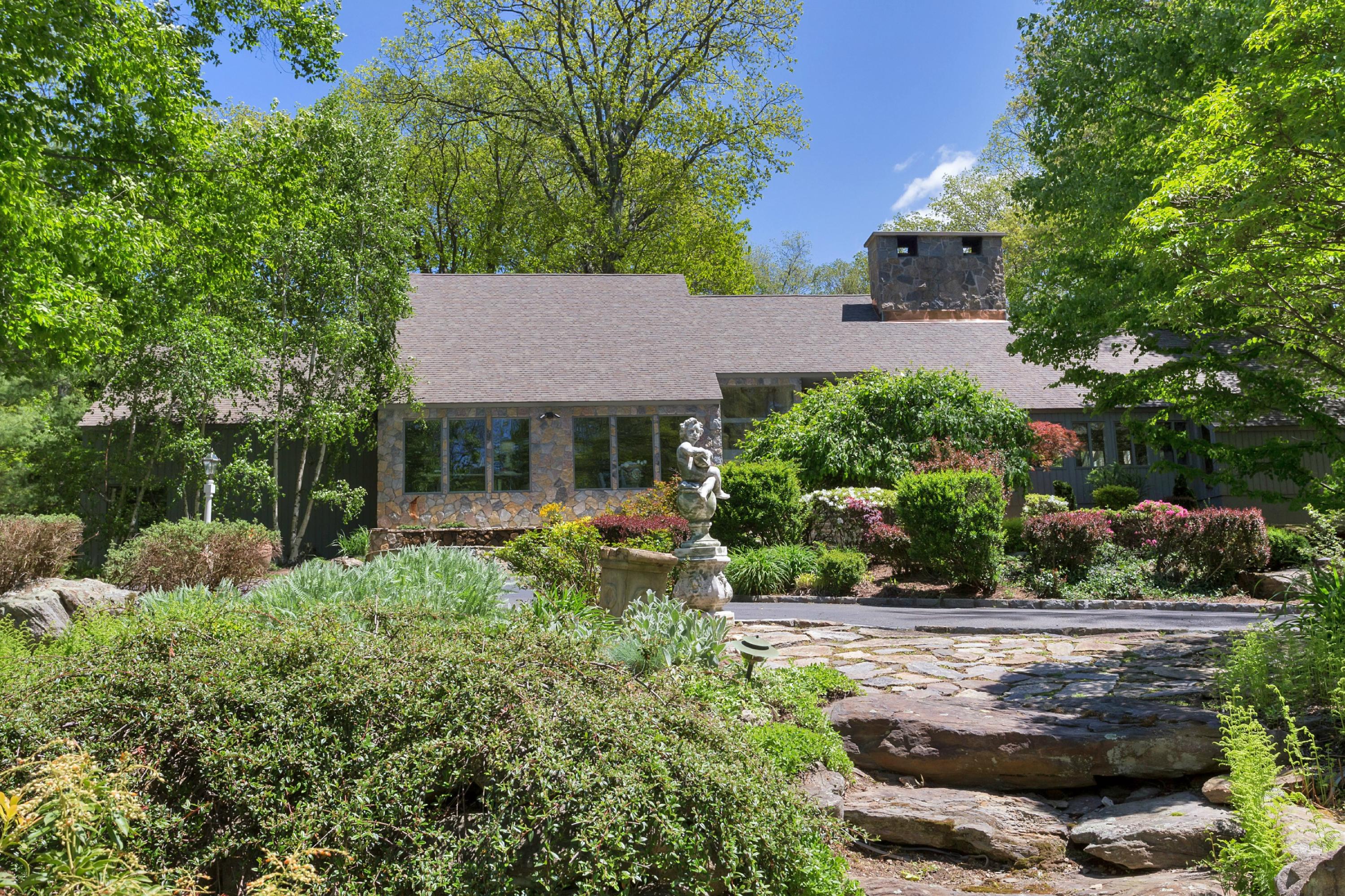 67 Sumner Road Greenwich, CT 06831 - Photo 24 of 25 a view of house with a yard and potted plants