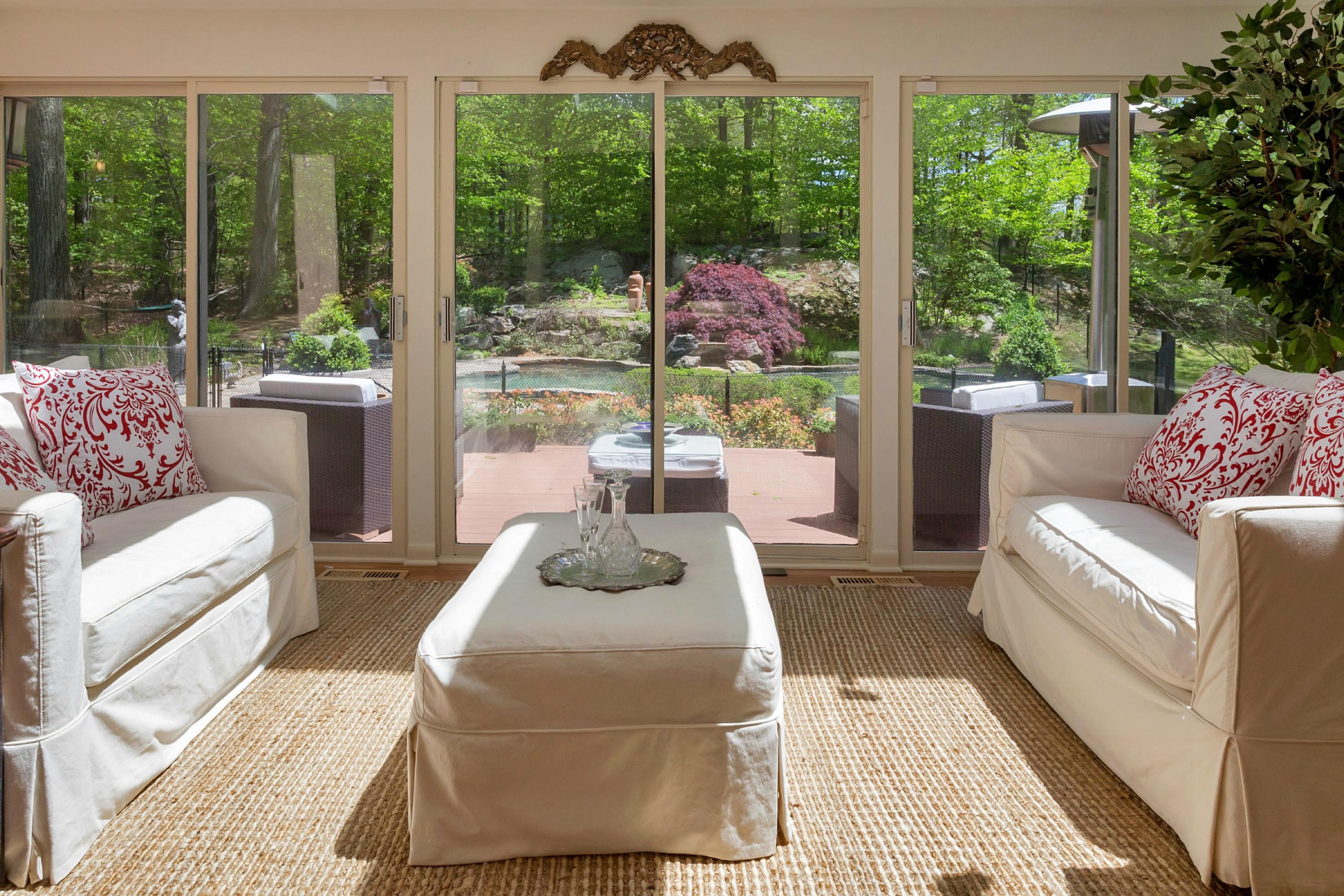 67 Sumner Road Greenwich, CT 06831 - Photo 6 of 25 a living room with couch and a large window