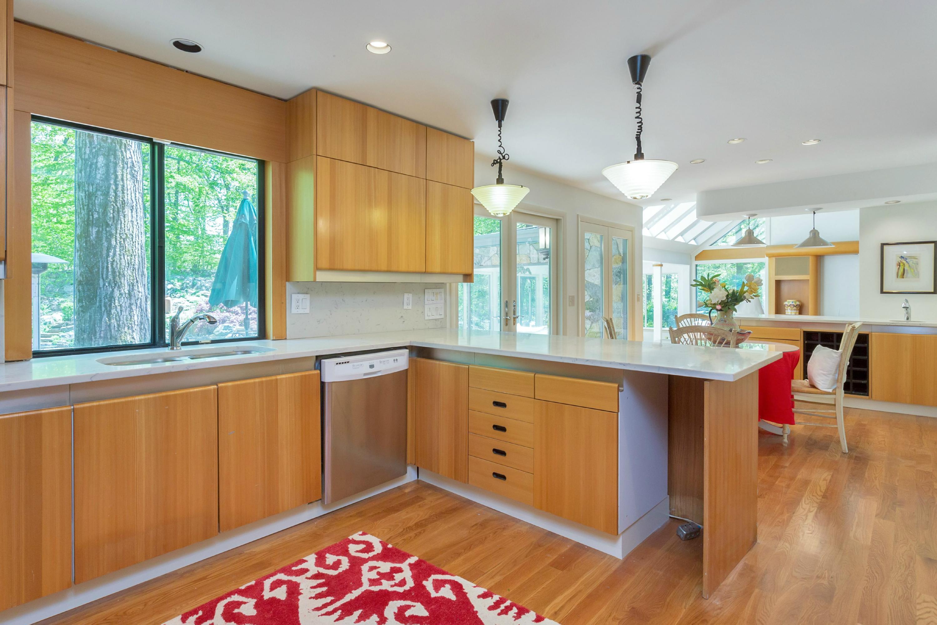 67 Sumner Road Greenwich, CT 06831 - Photo 8 of 25 a kitchen with stainless steel appliances granite countertop a sink a stove and a wooden floors