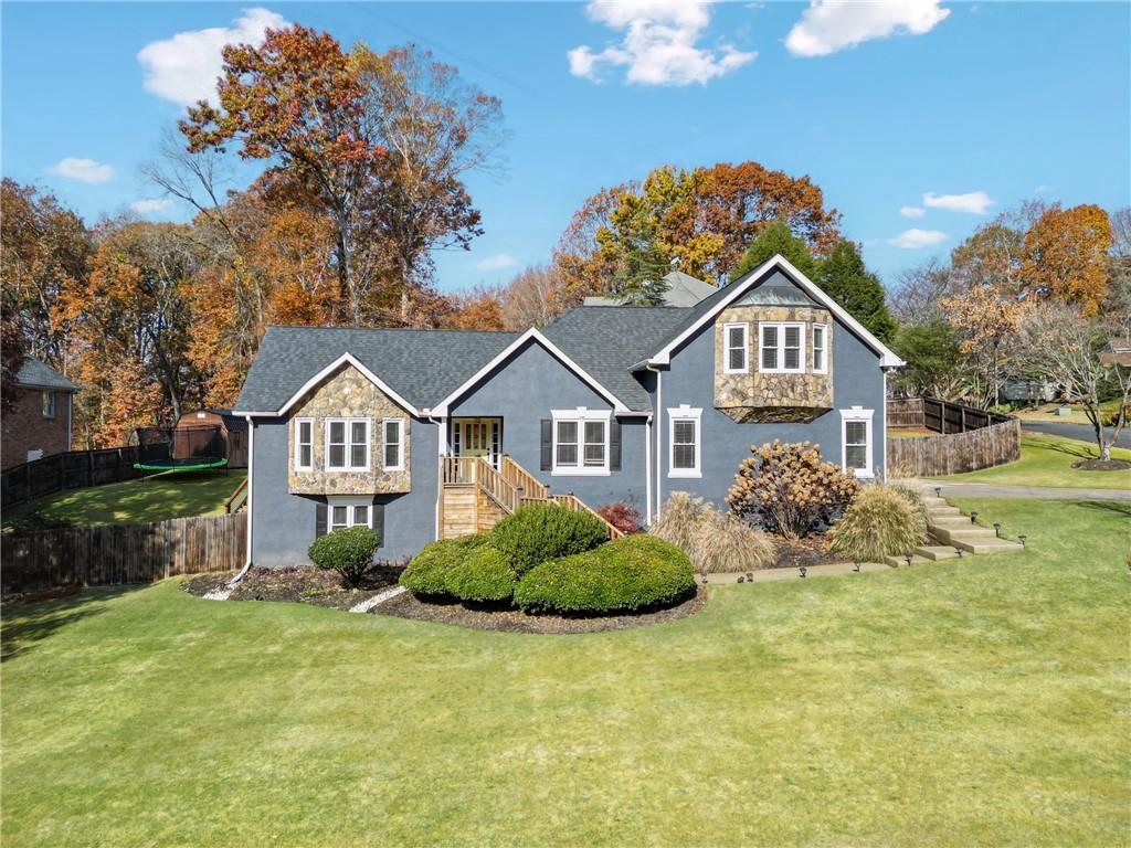 a front view of a house with a yard