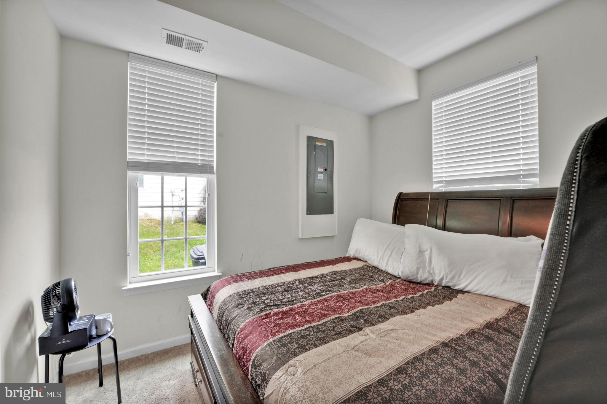 7138 Station House Road Elkridge, MD 21075 - Photo 37 of 42 a bedroom with a bed and window