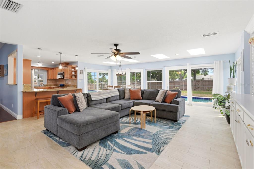 7432 Sparkling Lake Road Orlando, FL 32819 - Photo 21 of 54 a living room with furniture and a large window