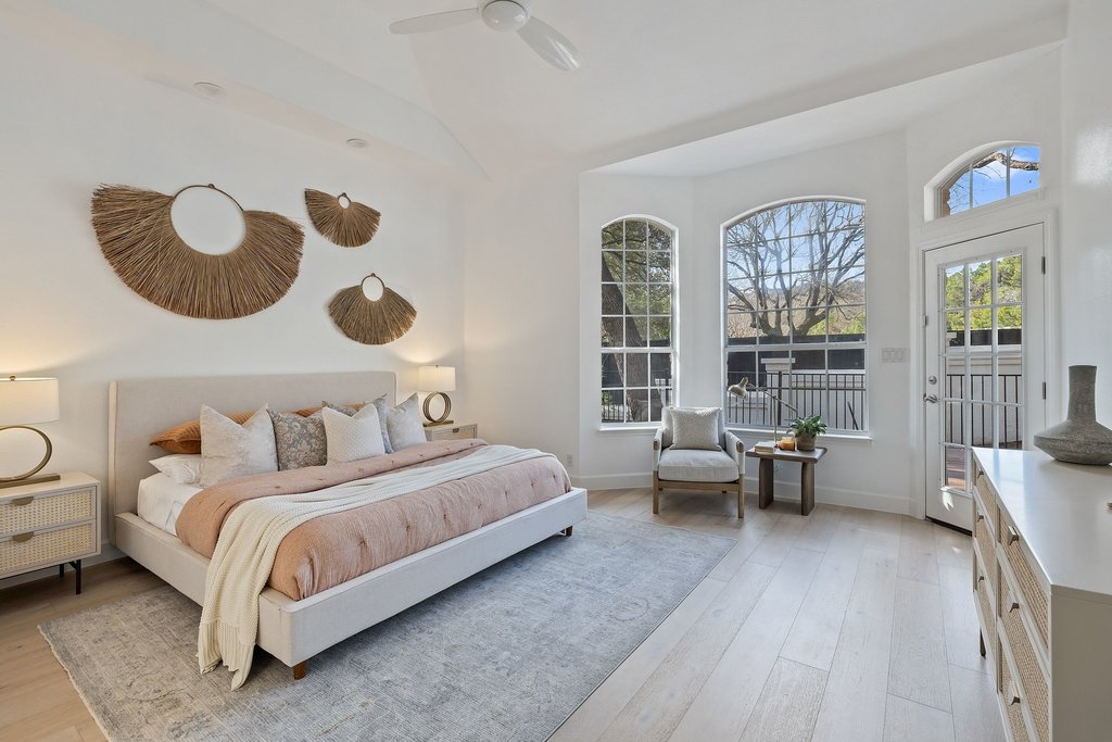 1815 Rue De St Tropez Austin, TX 78746 - Photo 14 of 39 Bedroom with access to exterior, light wood-style flooring, ceiling fan, and lofted ceiling