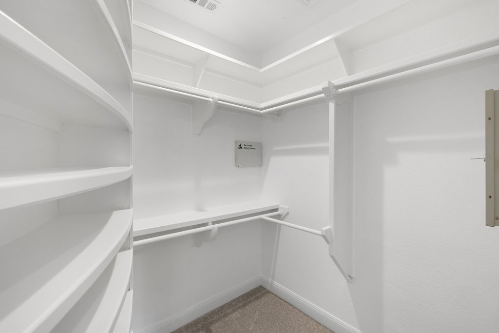 1815 Rue De St Tropez Austin, TX 78746 - Photo 17 of 39 Walk in closet with light colored carpet