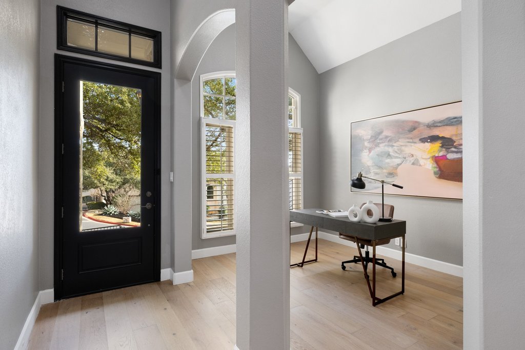 1815 Rue De St Tropez Austin, TX 78746 - Photo 6 of 39 Entrance foyer featuring light wood finished floors, healthy amount of natural light, and lofted ceiling