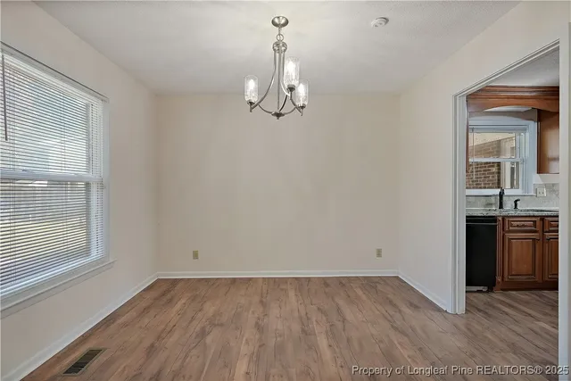 an empty room with a kitchen
