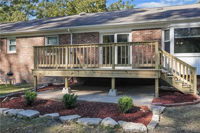 a balcony with table and chairs