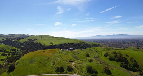 an aerial view of a houses with a yard