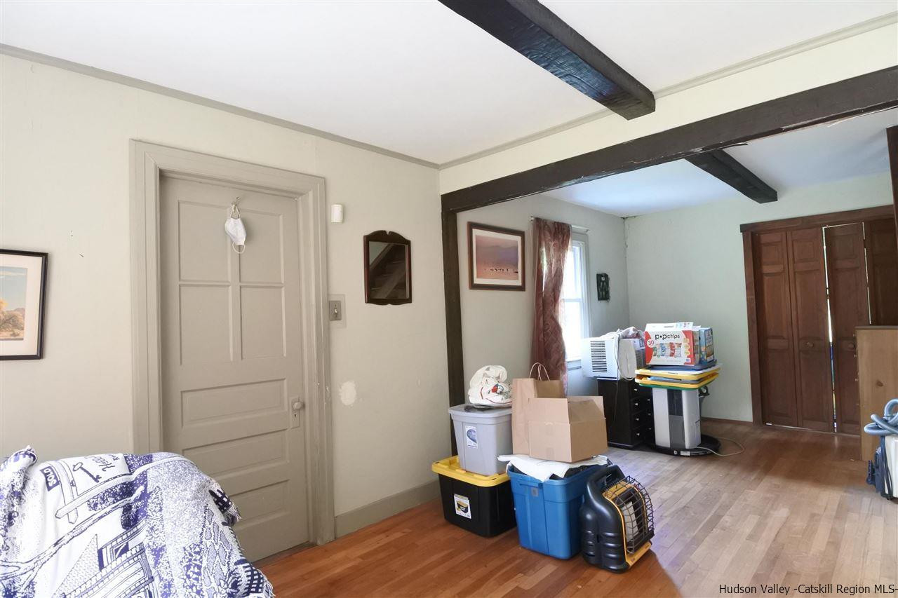 284 Bush Road Stone Ridge, NY 12484 - Photo 14 of 34 a bedroom with furniture and wooden floor
