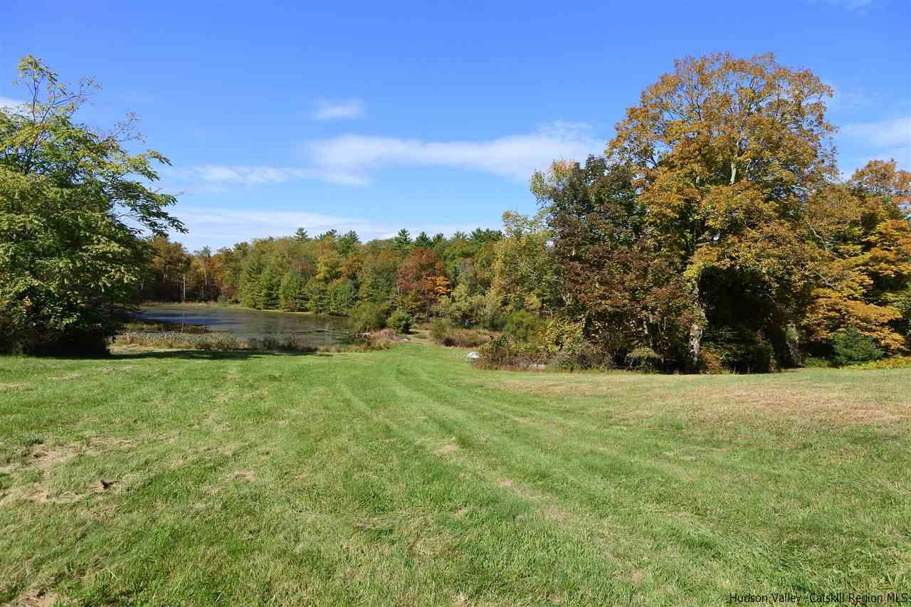 284 Bush Road Stone Ridge, NY 12484 - Photo 21 of 34 a view of outdoor space with deck and yard