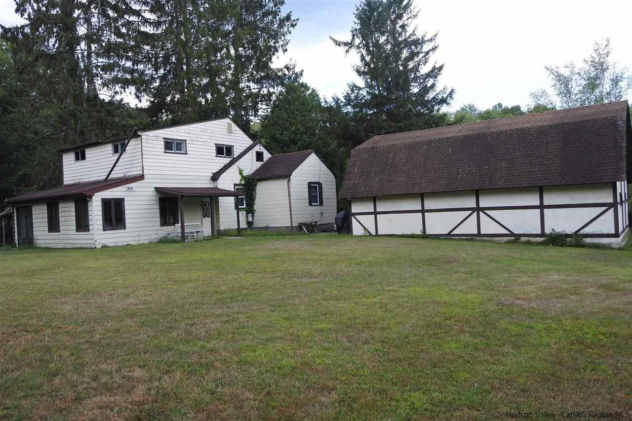 284 Bush Road Stone Ridge, NY 12484 - Photo 7 of 34 a front view of a house with garden